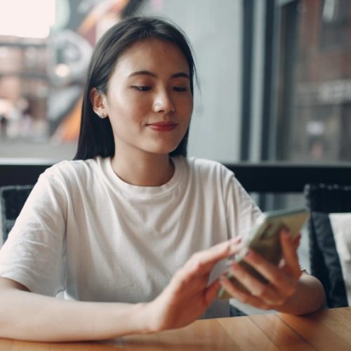 Person enjoying online streaming on couch